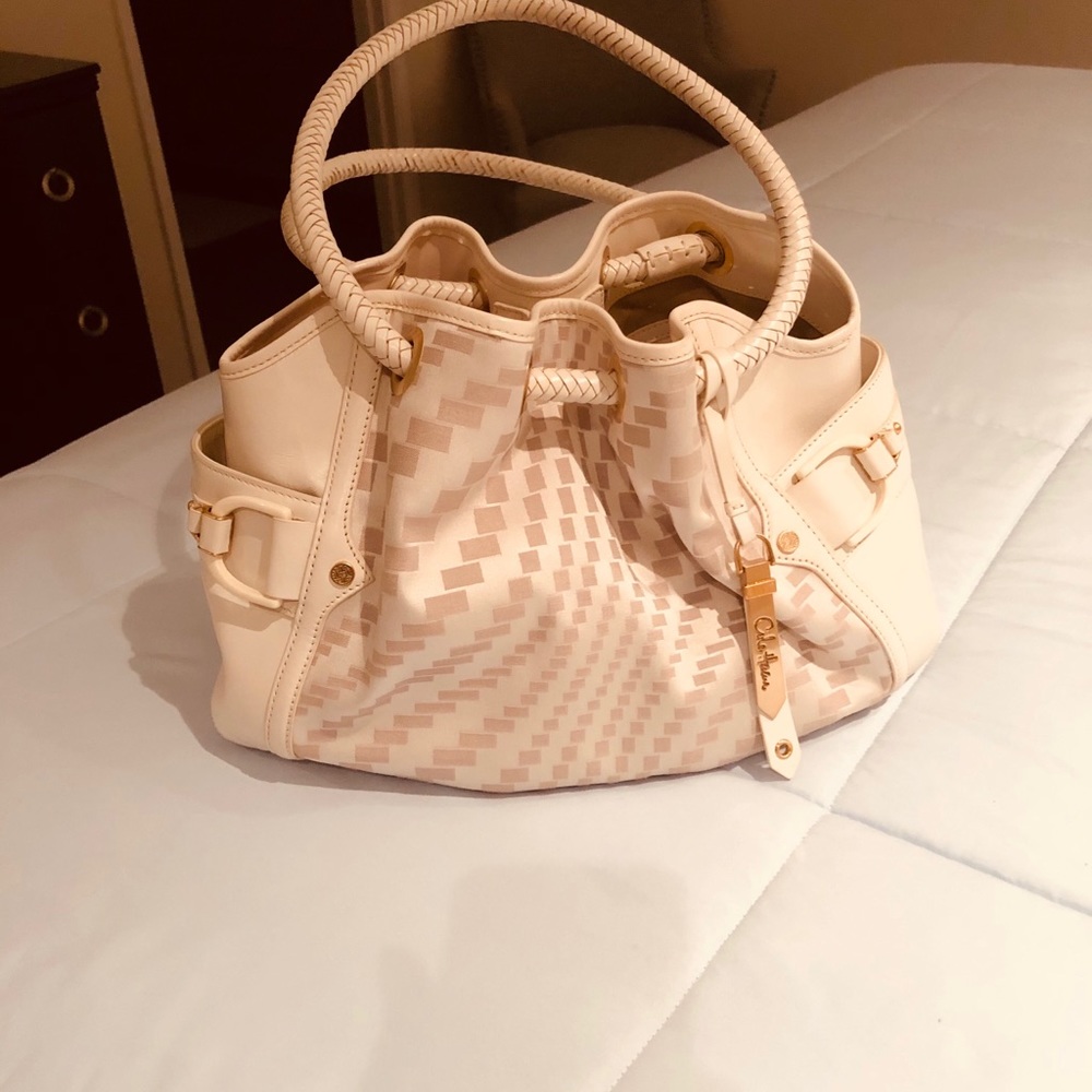 Cole Haan offwhite  with gold trim tote bag.